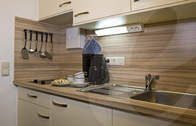 Küche im Appartement in Bad Füssing (Die Appartements im Appartementhof in Bad Füssing verfügen über eine voll augestattete Wohnküche.)